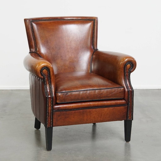 Fauteuil en peau de mouton à la finition luxueuse