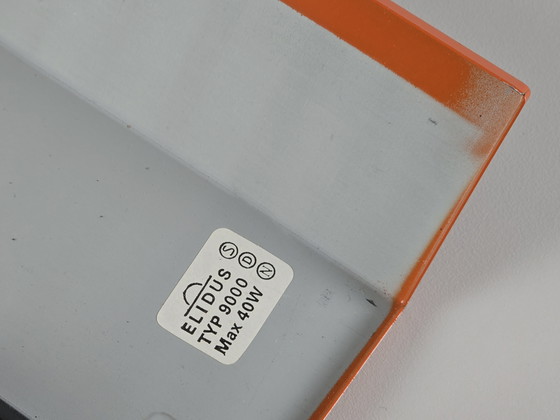Image 1 of 1970 Vintage ELIDUS Type 9000 Orange Metal Wall Light avec grille en plastique perforée par Björn Svensson.