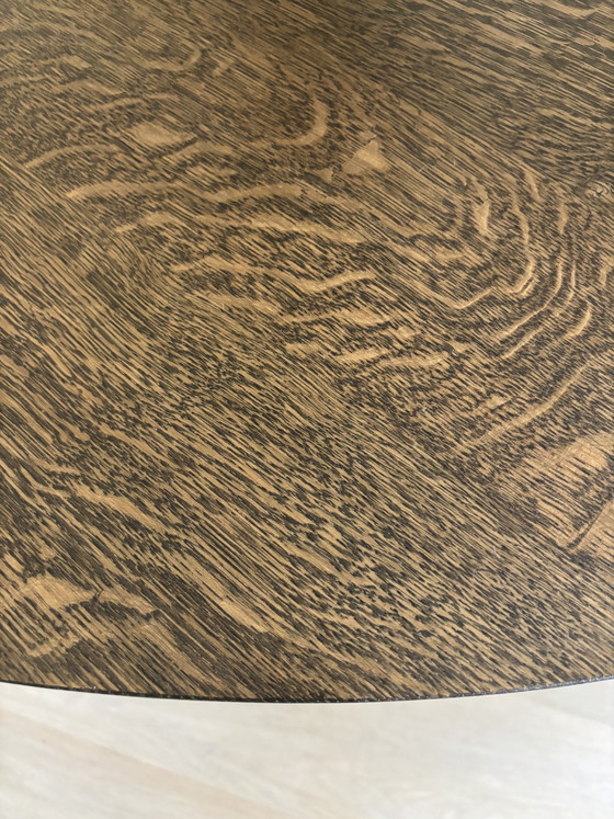 Image 1 of Round solid oak table with veneer top. Bought at Maison Manon.