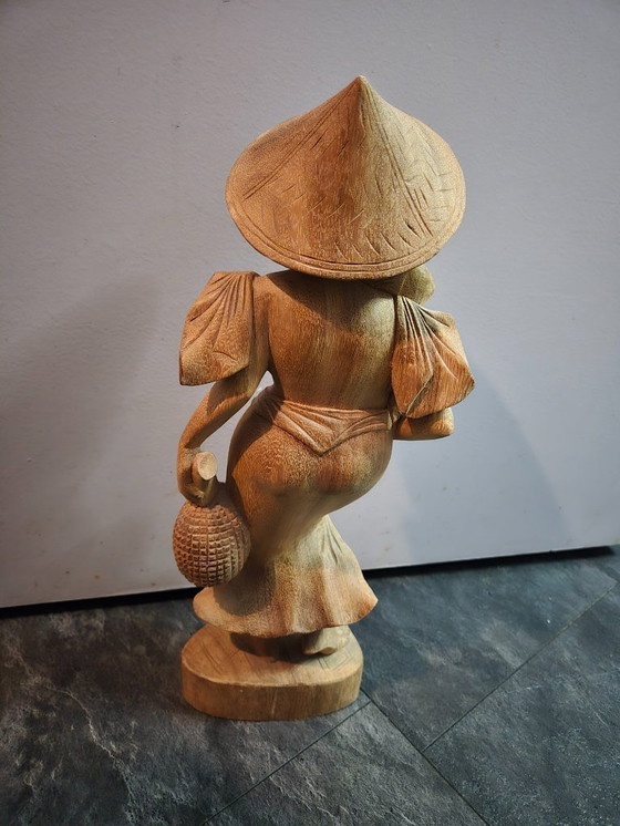 Image 1 of Balinese wooden female statue. Height 44 cm