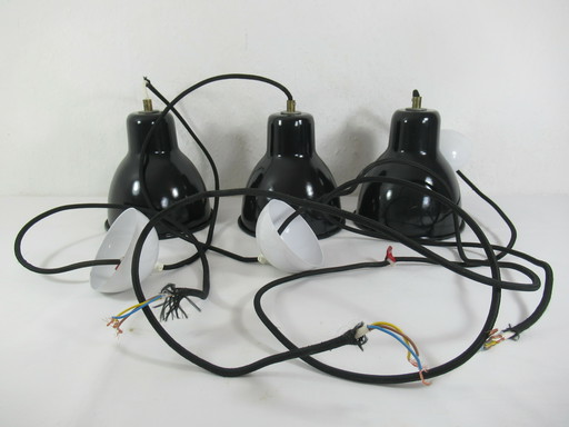 Set of three industrial-style ceiling lights made of black and white metal