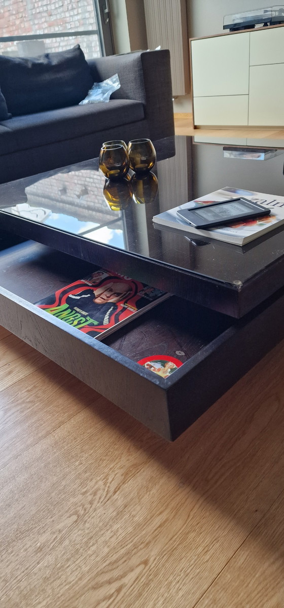 Image 1 of Veneer coffee table with dark glass top