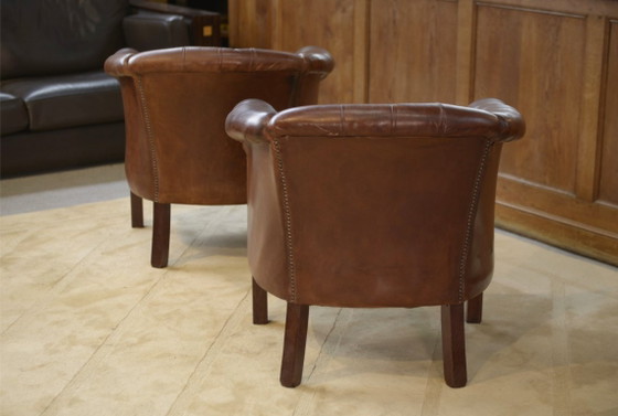 Image 1 of Een paar met leer beklede clubstoelen