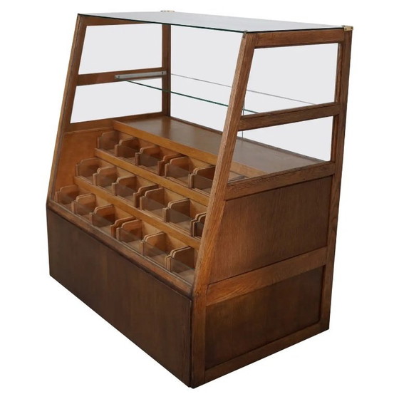 Image 1 of Antieke Spaanse fourniturenkast / winkeltoonbank in beuken- en eikenhout, jaren 1950