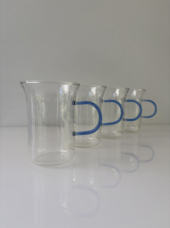 Image 1 of Set of four glass tea mugs with colored handles