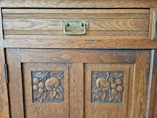 Antique cabinet with grape motif