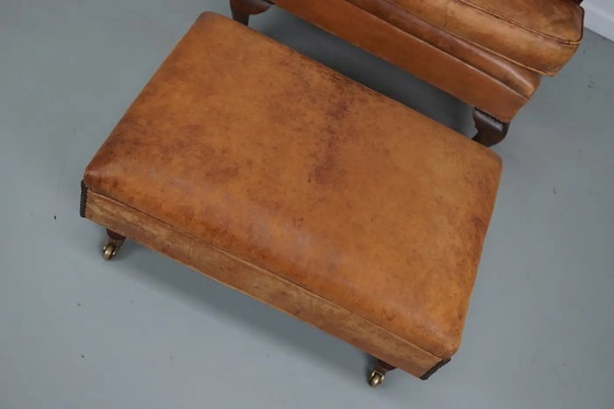 Image 1 of Vintage Nederlandse cognackleurige leren clubfauteuil met voetenbank