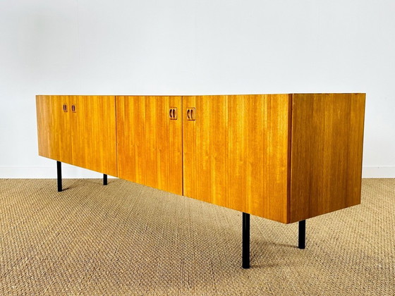 Image 1 of Minimalist Scandinavian sideboard in teak with black metal legs, 1960