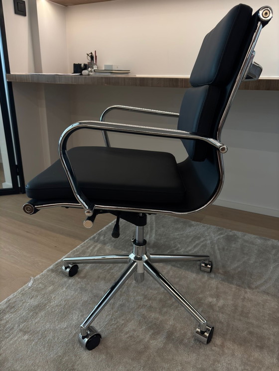 Image 1 of Eames black imitation leather office chair with castors.