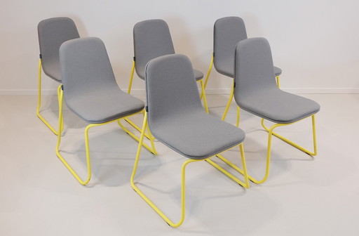 Bogaerts stackable cantilever chair in yellow frame with gray upholstery