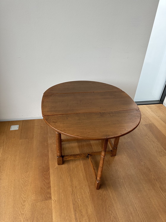 Image 1 of Opvouwbare eiken tafel 'a bandelle