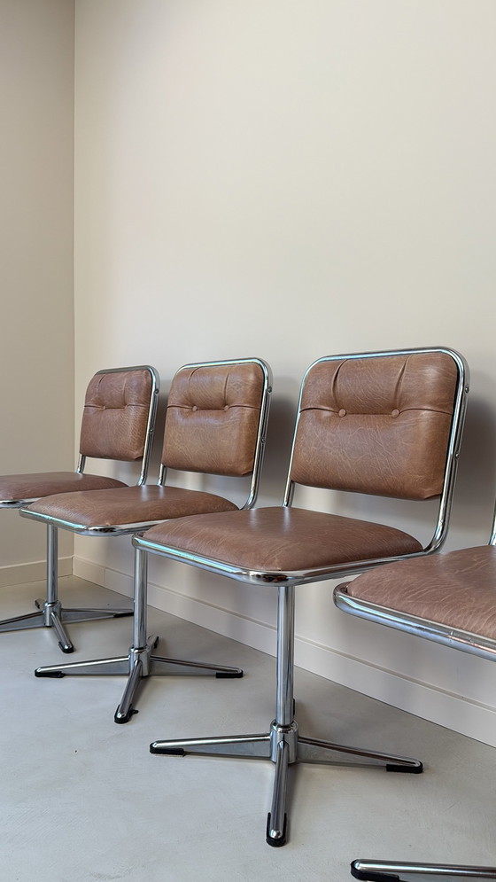 Image 1 of Four vintage chrome swivel chairs with faux leather