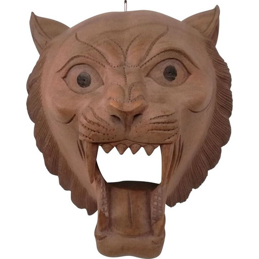 Vintage carved wooden mask representing a roaring tiger