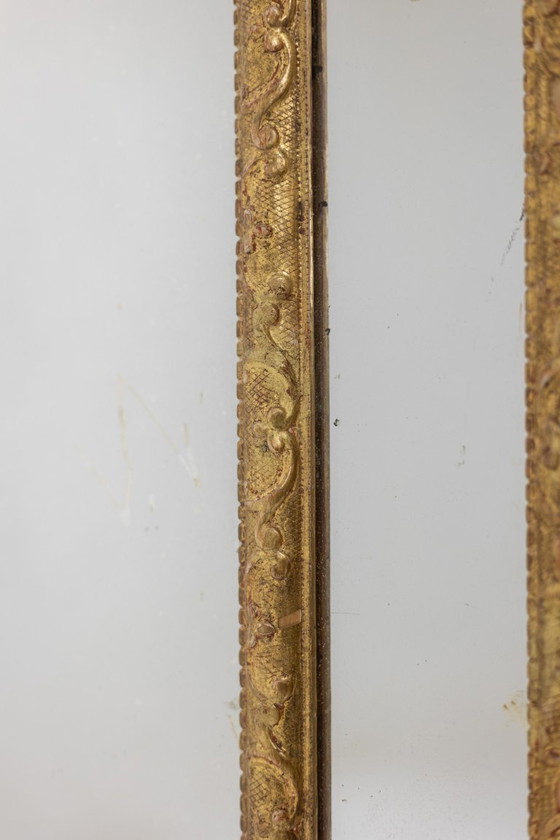 Image 1 of Mayfair. Grand miroir perlé en bois sculpté de style Régence. 20ème siècle.