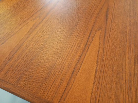 Image 1 of Scandinavian rectangular vintage dining table by Johannes Andersen for Samcom from the 60s in teak with integrated extensions