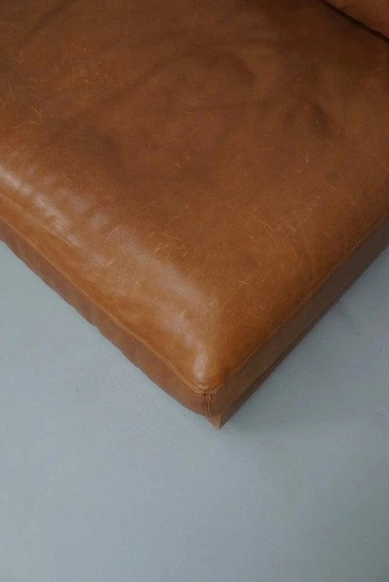 Image 1 of De Sede DS 76 loungestoel / slaapbank van cognackleurig leer, Zwitserland, jaren 1970