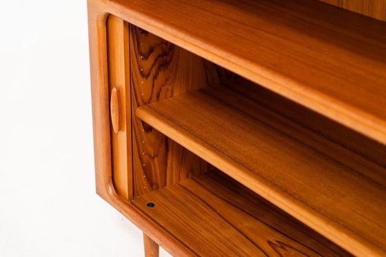 Image 1 of Bookcase in teak by Svend Dyrlund with tambour doors (Denmark, 1960s).