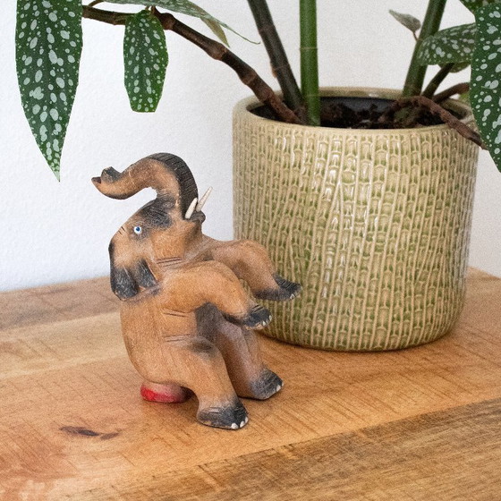 Image 1 of Vintage hand-carved circus elephant figurine: handmade animal sculpture