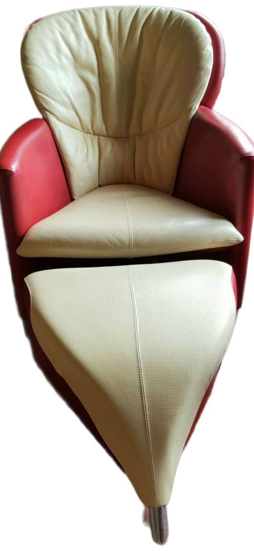 Poltrona Leolux Excalibur in pelle rossa e bianco sporco con poggiapiedi