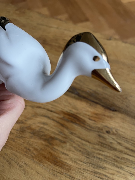 Image 1 of 2 porseleinen vogels met 24 karaat goud