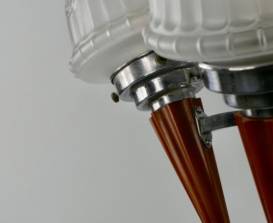 Image 1 of Chrome Art Deco chandelier with four amber Bakelite torches with decorated glass lampshades, ca. 1935