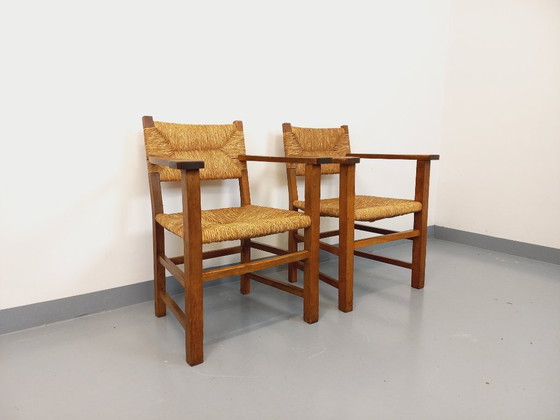 Image 1 of Suite van 2 vintage Brutalistische fauteuils in eiken en stro uit de jaren 60