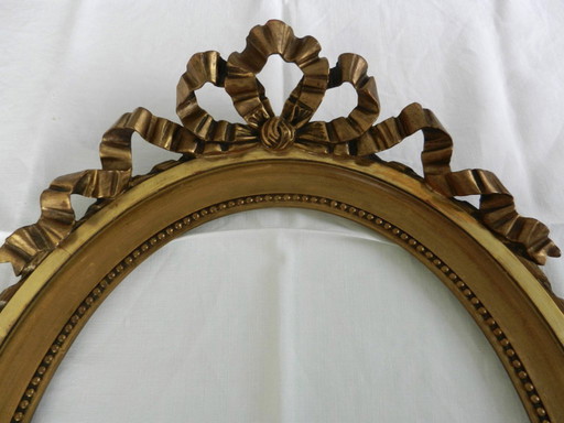 Cornice ovale antica in legno dorato, nodo stile Luigi XVI