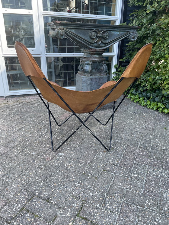 Image 1 of Jaren 60 vlinderstoel met tuiglederen zitting