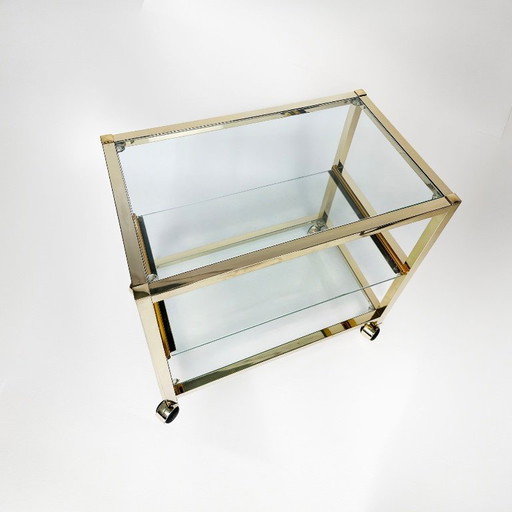 Vintage bijzettafel uit de jaren 80 met gouden chromen afwerking.