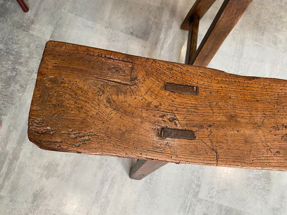 Image 1 of Twee massief eikenhouten boerenbanken van 214 cm voor een rustieke boerentafel uit de jaren 50.