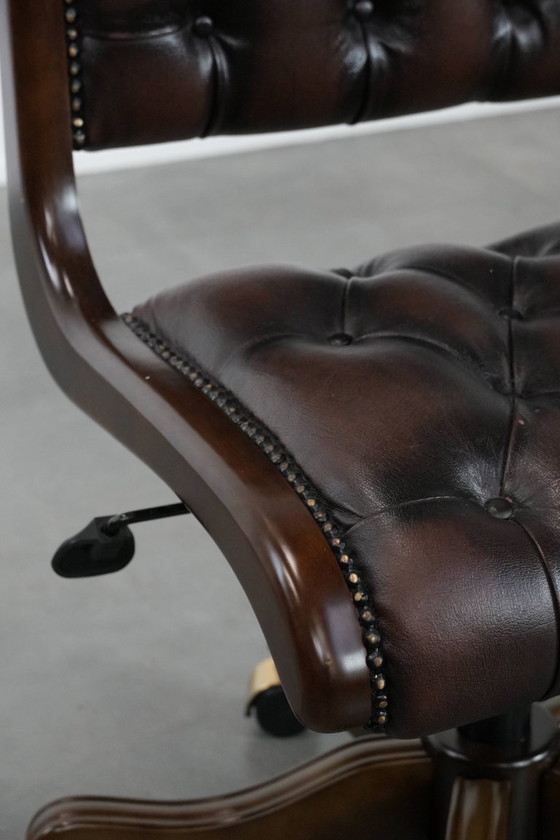 Image 1 of English-style Chesterfield office chair made of cowhide and wood on wheels
