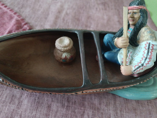 An Indian in canoe