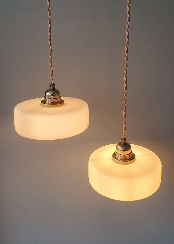 Image 1 of Vintage pendant lamp set (2) of yellow pastel opaline glass. Art Deco design.