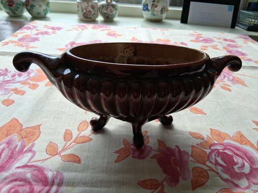 Cool brown cast iron vase.