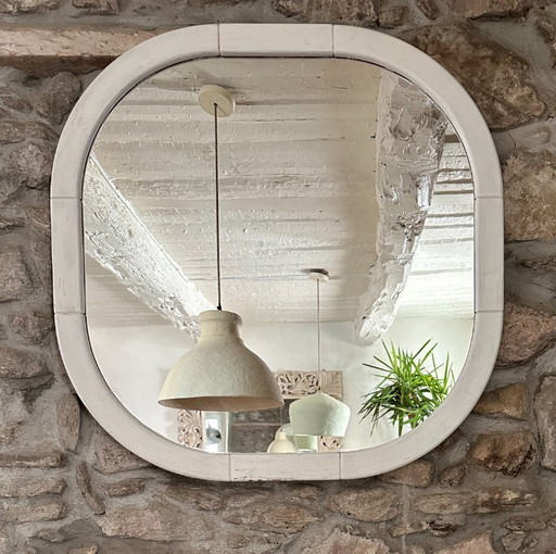 Large Space Age wall mirror in white patinated wood. France, 1970s