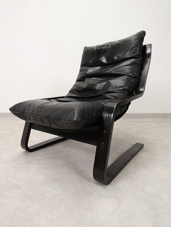 Image 1 of  high-back lounge chair in black leather