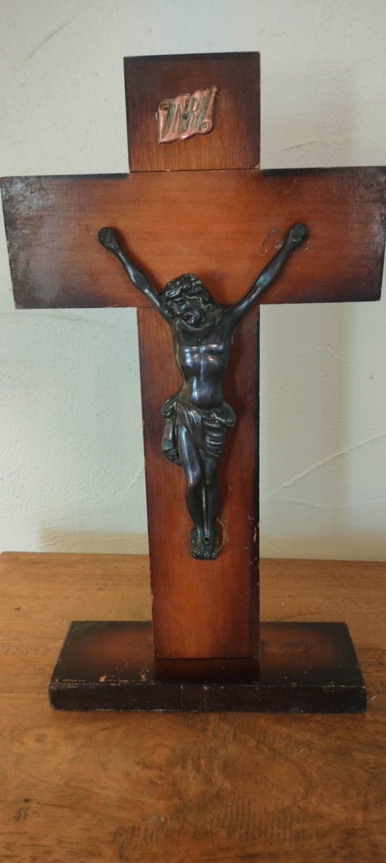 Image 1 of Small copper crucifix on a wooden plank