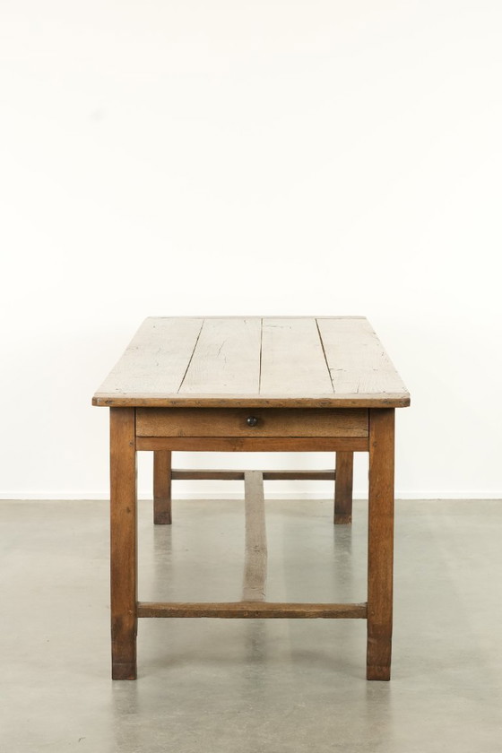 Image 1 of Large antique French farmhouse dining table made of oak from the early 1800s