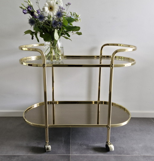 Vintage Bar Trolley/serving trolley in Hollywood Regency style - brass & glass