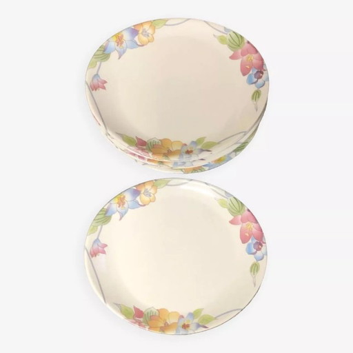 15 plates with multicolored floral designs