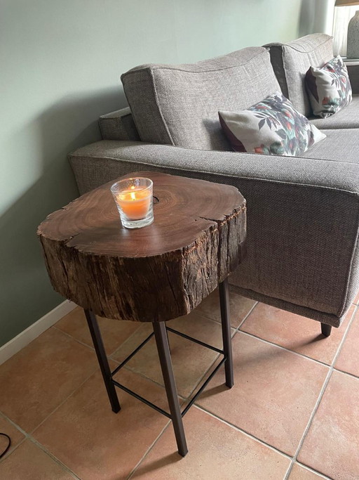 Robust side table made from an old mooring post and steel frame