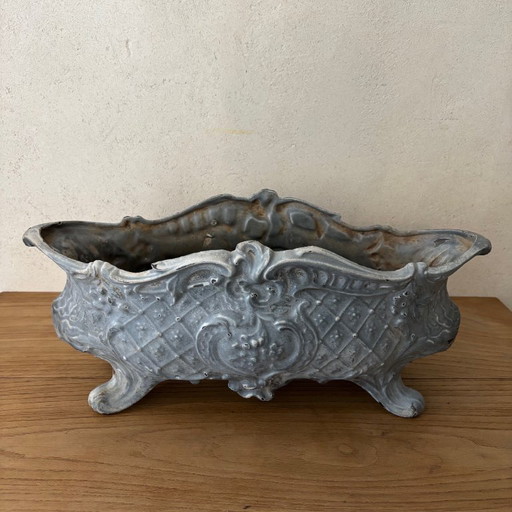 Antica fioriera in ghisa smaltata