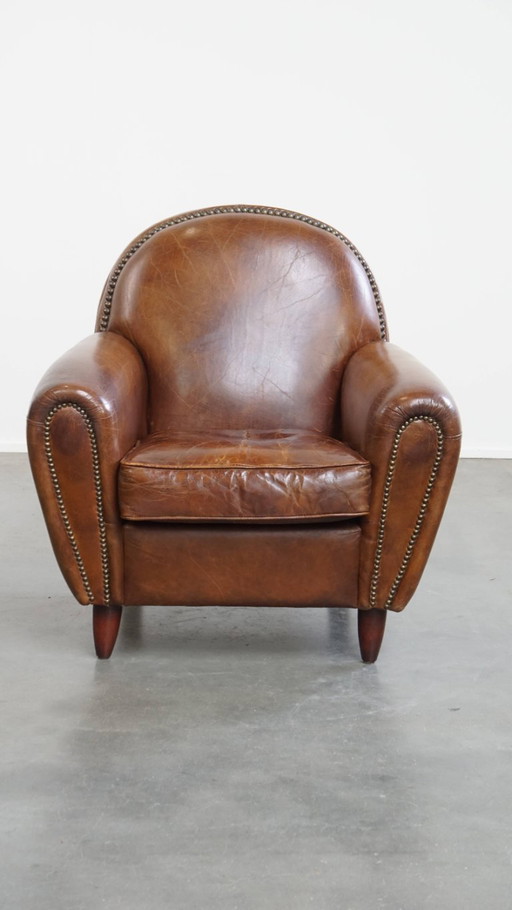 Fauteuil en cuir de boeuf aux formes arrondies