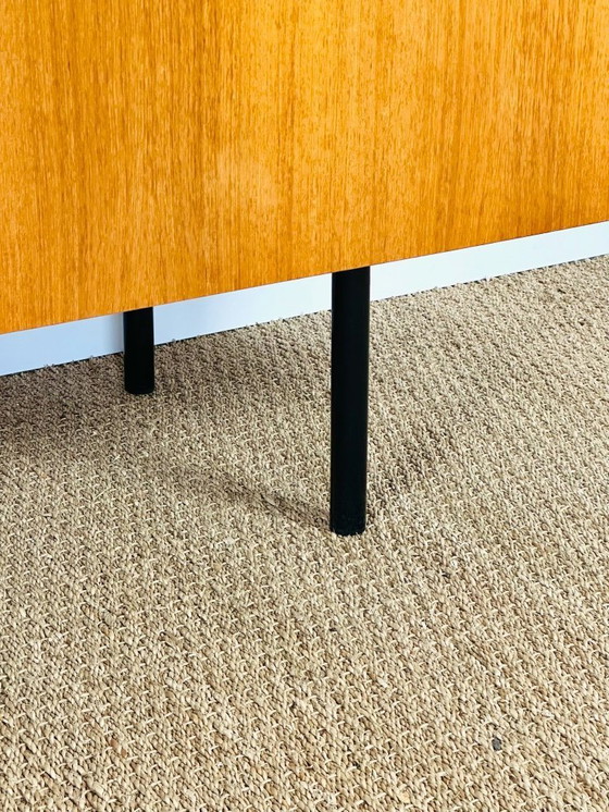 Image 1 of Minimalist Scandinavian sideboard in teak with black metal legs, 1960
