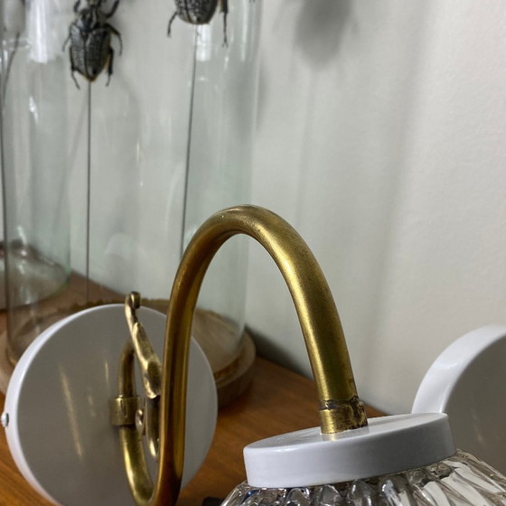 Image 1 of Large pair of brass gooseneck wall lights, clear glass globes, white metal rosettes