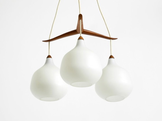 Image 1 of Beautiful pendant lamp with three opal glass shades and a teak frame by Uno & Östen Kristiansson for Luxus Vittsjö, Sweden 1957