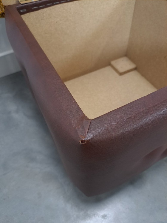 Image 1 of Ottoman with lid on chrome wheels