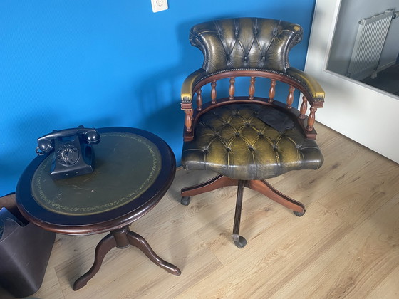 Image 1 of 1 Vintage round side/ wine table with leather top upholstery.