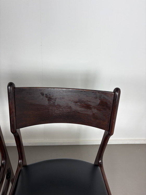 Image 1 of Set off 4 Vintage Palissander Wood With Black skai Leather dining chairs