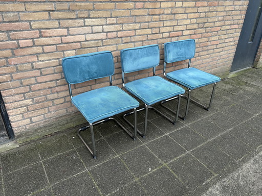 3 sedie in tessuto a coste con struttura tubolare cromata